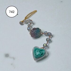 Handmade Irridescent Flower Car Charm with Teal Blue Heart Design.